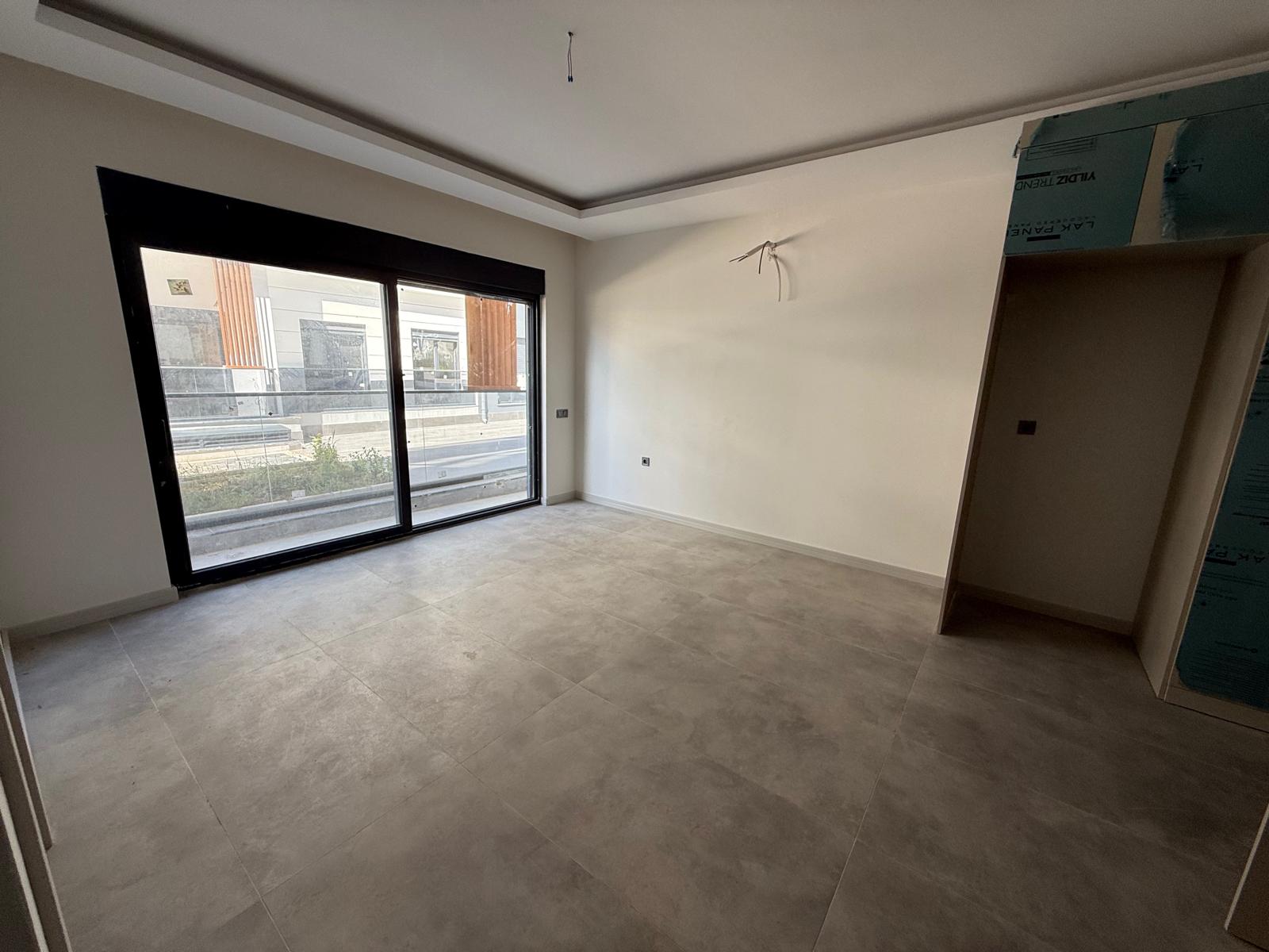 Triada Akdeniz’de Kiralık 1+1 Sıfır Daire | Havuzlu Site, Otoparklı, Güvenlikli - Resim 18