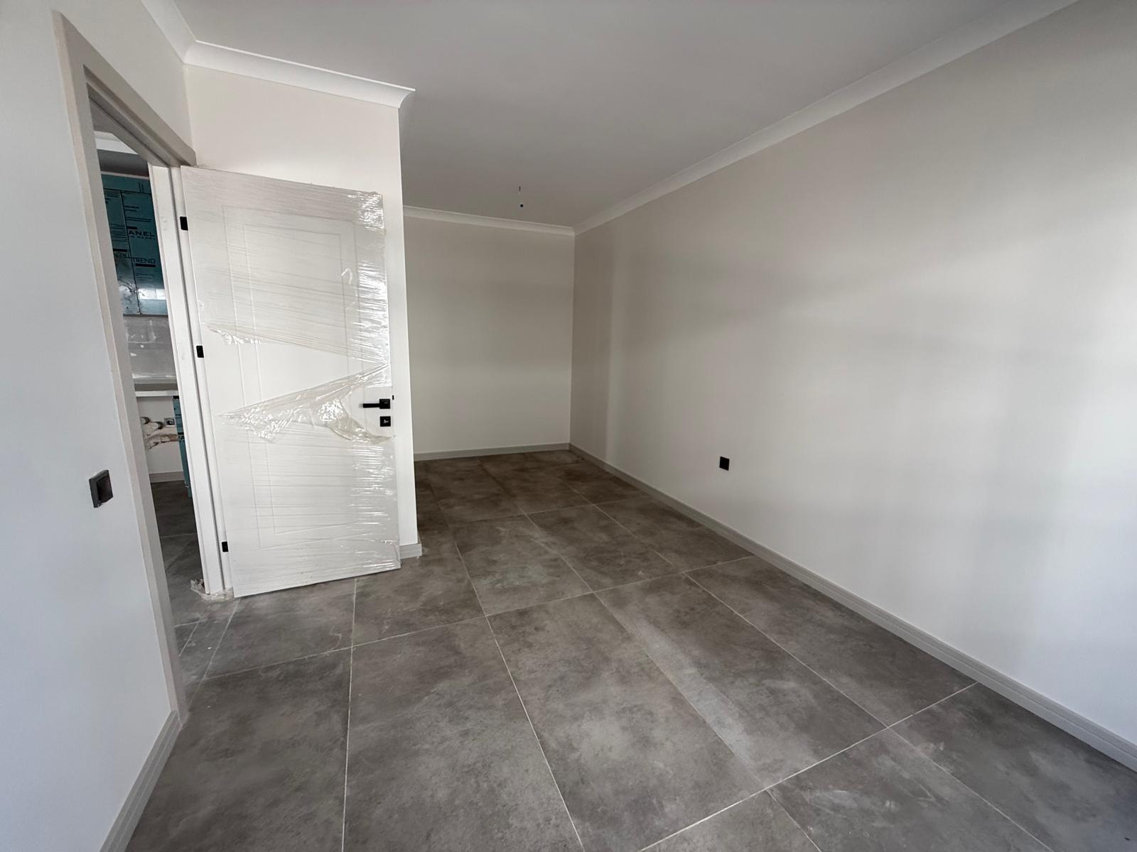 Triada Akdeniz’de Kiralık 1+1 Sıfır Daire | Havuzlu Site, Otoparklı, Güvenlikli - Resim 14