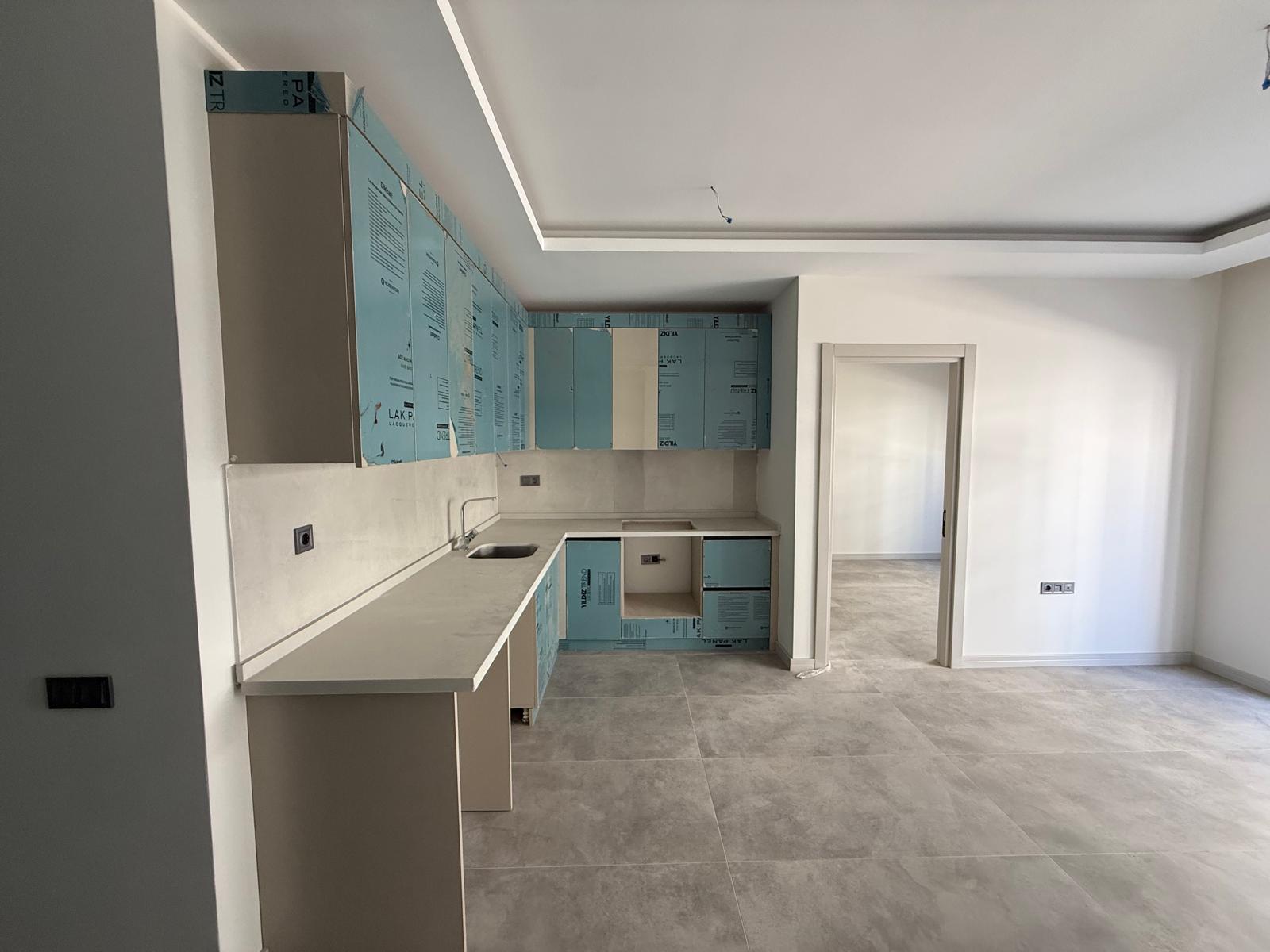 Triada Akdeniz’de Kiralık 1+1 Sıfır Daire | Havuzlu Site, Otoparklı, Güvenlikli - Resim 9
